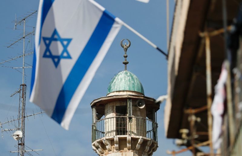 israeli flag and a minaret