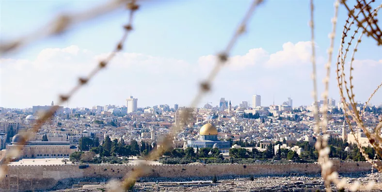 view of temple mount through barbed wire