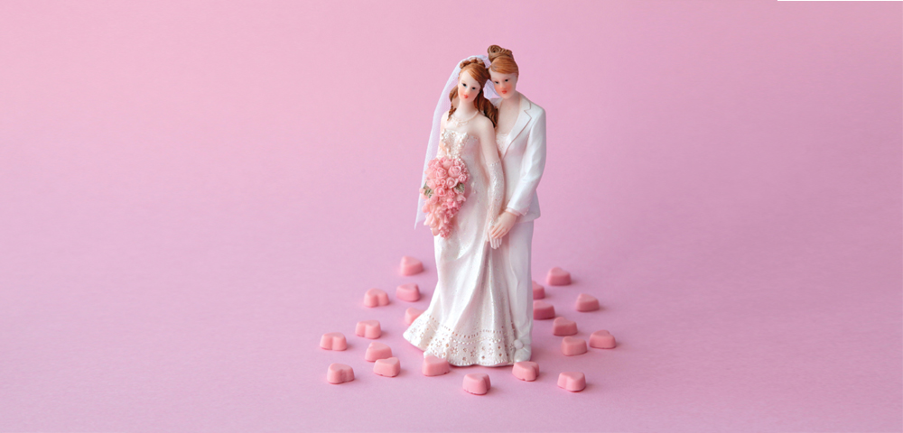 wedding cake topper with two women