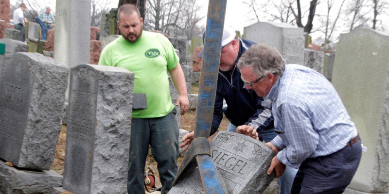 cleaning up at a Jewish cemetery