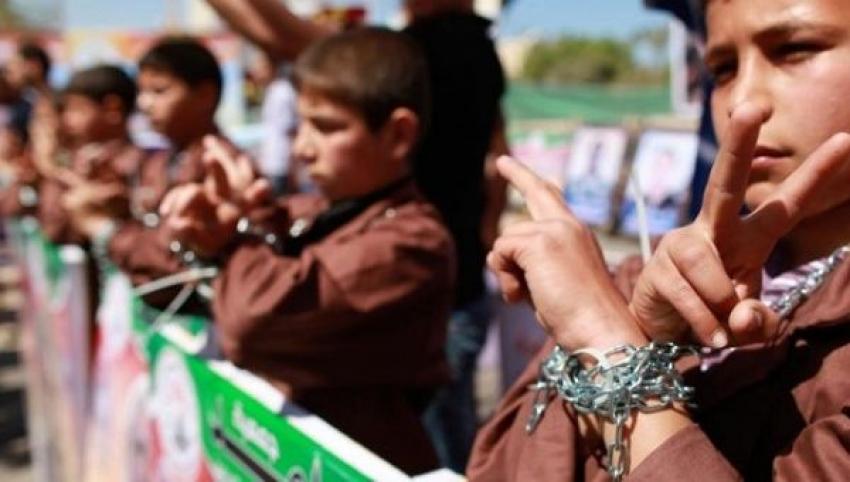 Children in gaza protesting with hands chained
