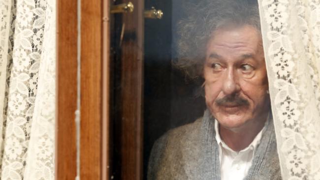 Geoffrey Rush as Einstein peeking out a window