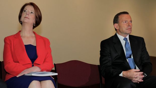 Abbott and Gillard sitting awkwardly near each other
