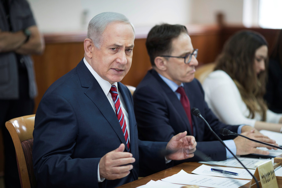 Bibi sitting at a meeting