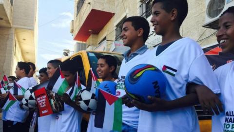 Palestinian kids with soccer stuff