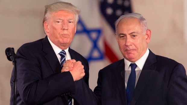 Trump and Bibi grasping hands in Israel
