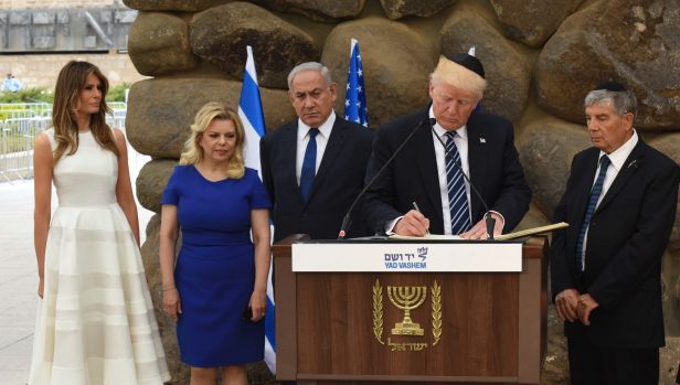 Trump signing the book at Yad Vashem