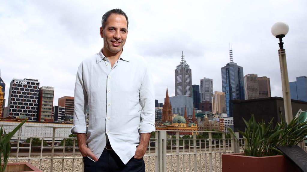 Yotam standing in front of Melbourne city skyline