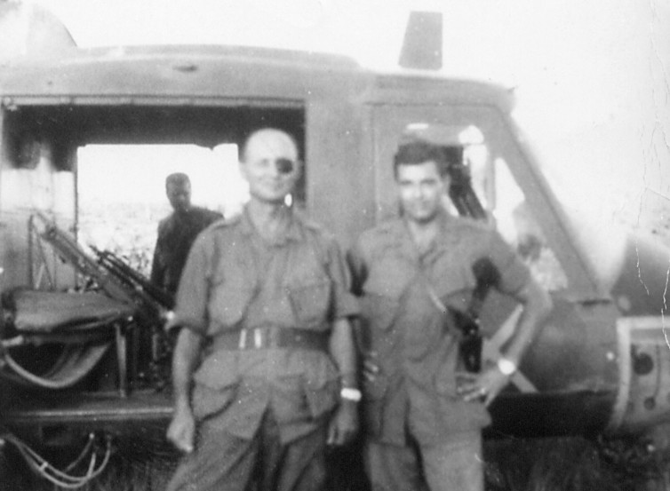Moshe Dayan standing with an unnamed soldier