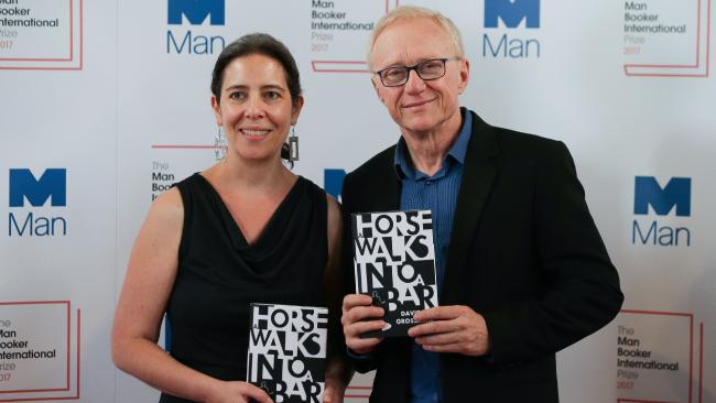 Grossman and Cohen standing holding a copy each of the book