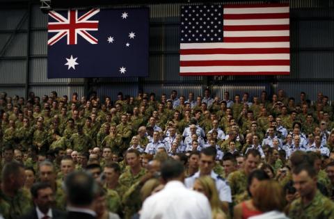 Australian soldiers in Darwin in a hall with american and austalian flags