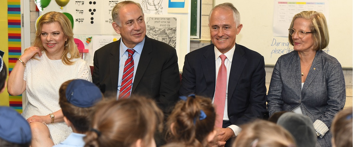 Prime Ministers Netanyahu and Turnbull and wives sitting at a kindergarten during australian visit