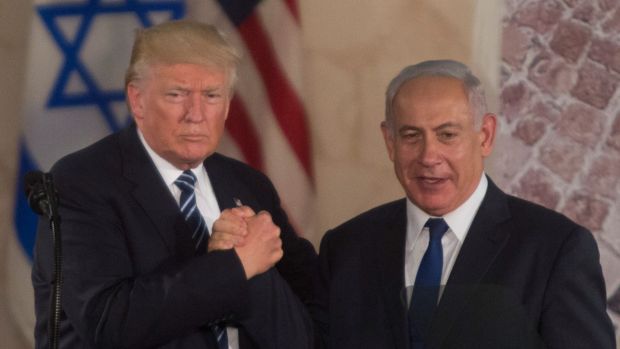 Trump and Bibi clasping hands in Israel