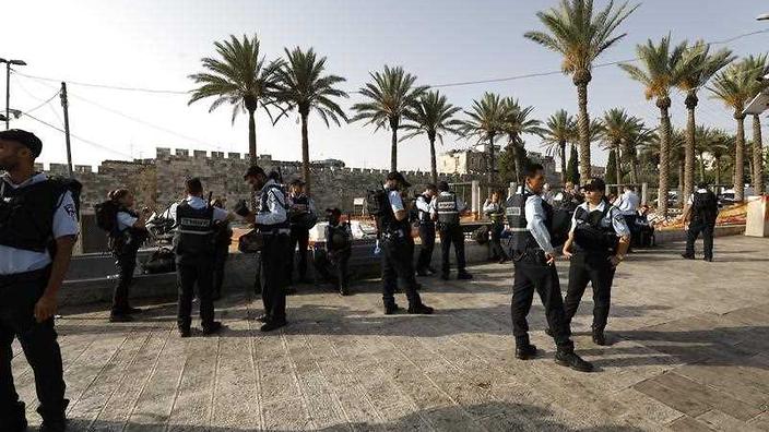 police officers outside the old city walls
