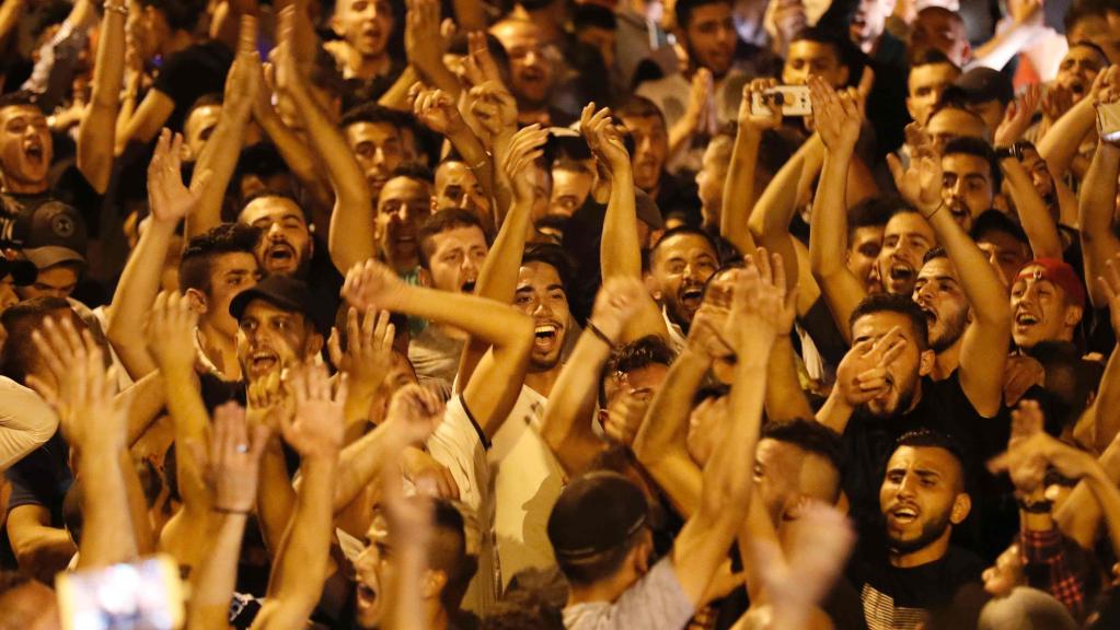 Palestinian crowd up close celebrating