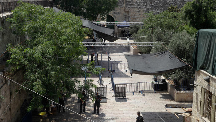 aerial view of old city area where israeli police are standing near cameras