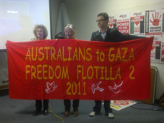 Vivienne and two others holding freedom flotilla sign