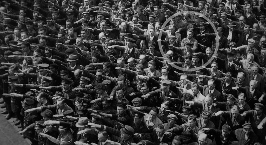 Crowd all saluting Hitler except for one man