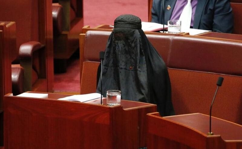 Pauline Hanson sitting in the Senate underneath a burqa