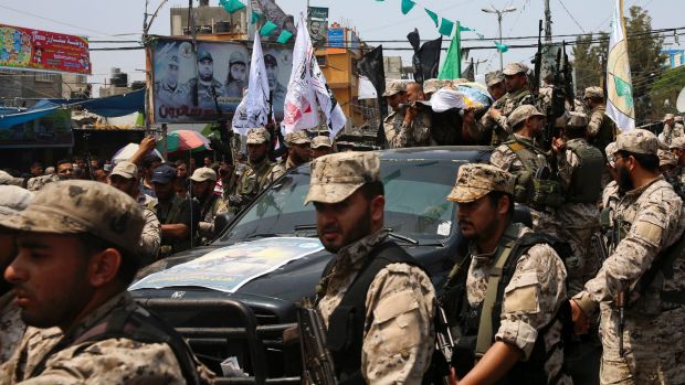 hamas militants in funeral procession