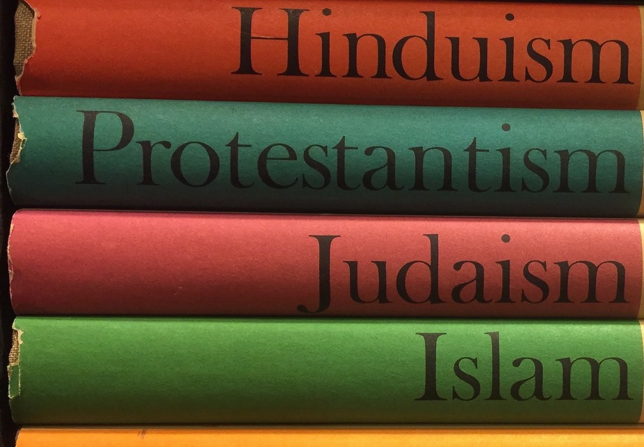 stack of books with the titles being religious groups