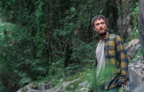 Daniel Radcliffe in a still from Jungle. standing in the jungle