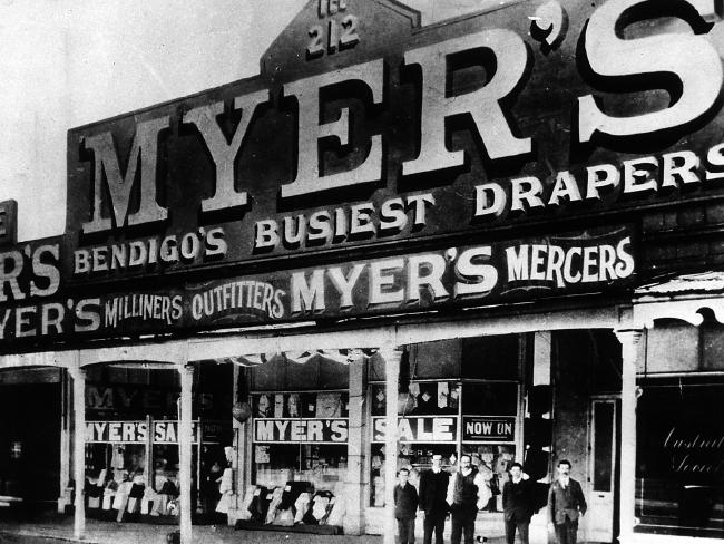 Myers deparment store front in 1910 with myer and others standing in front