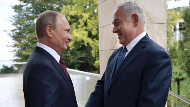 Vladimir and Bibi shaking hands happily