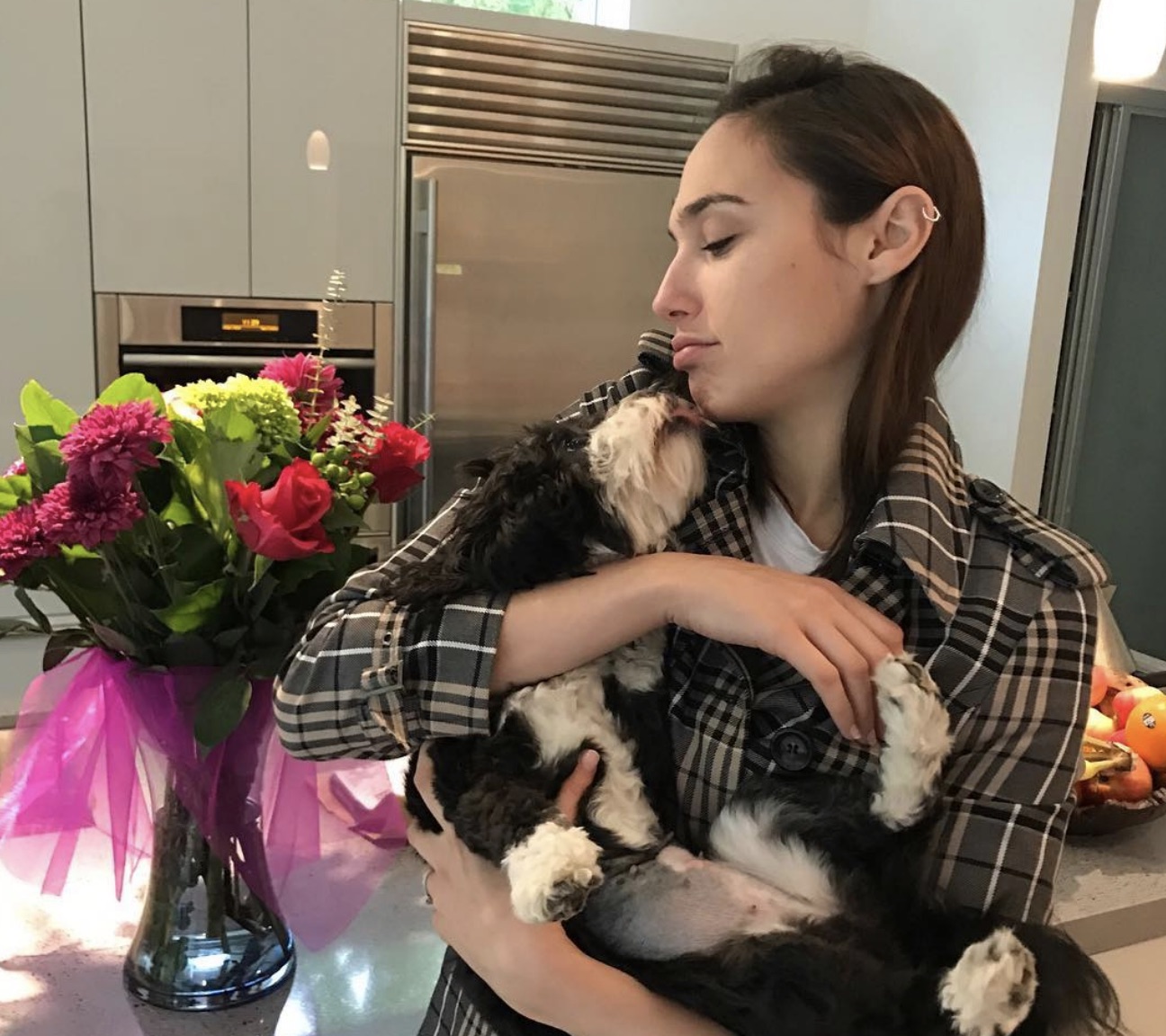 gal with her dog in her house