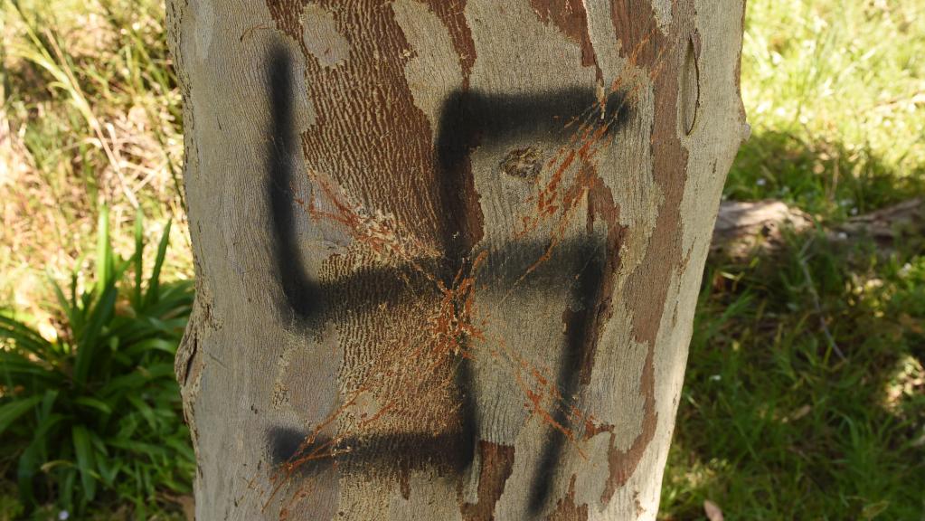 swastika painted on a tree