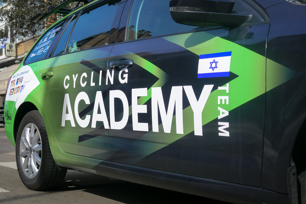 close up of car with the Israeli cycling academy's logo written on it