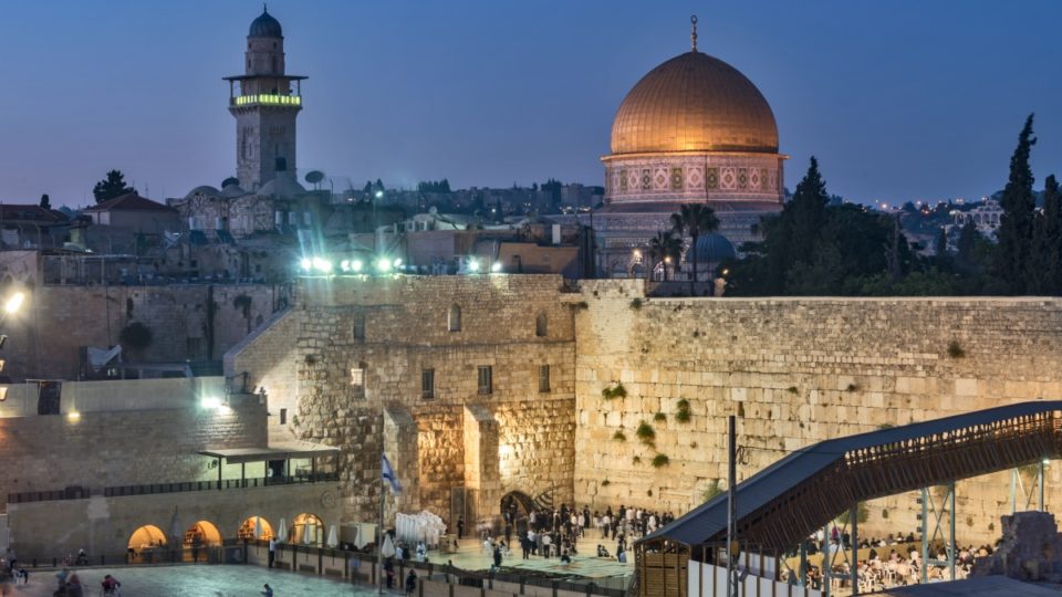 evening shot of kotel with dome of the rock in the background