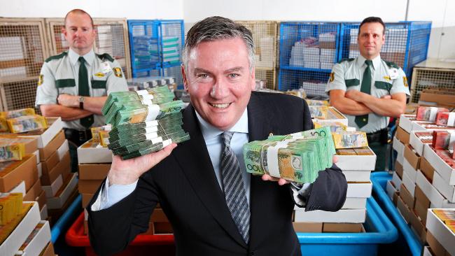 Eddie in publicity shot for his show, holding bundles of money
