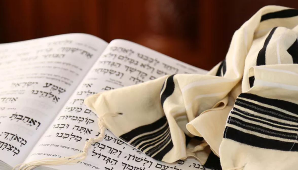 stock photo of prayer book and prayer shawl