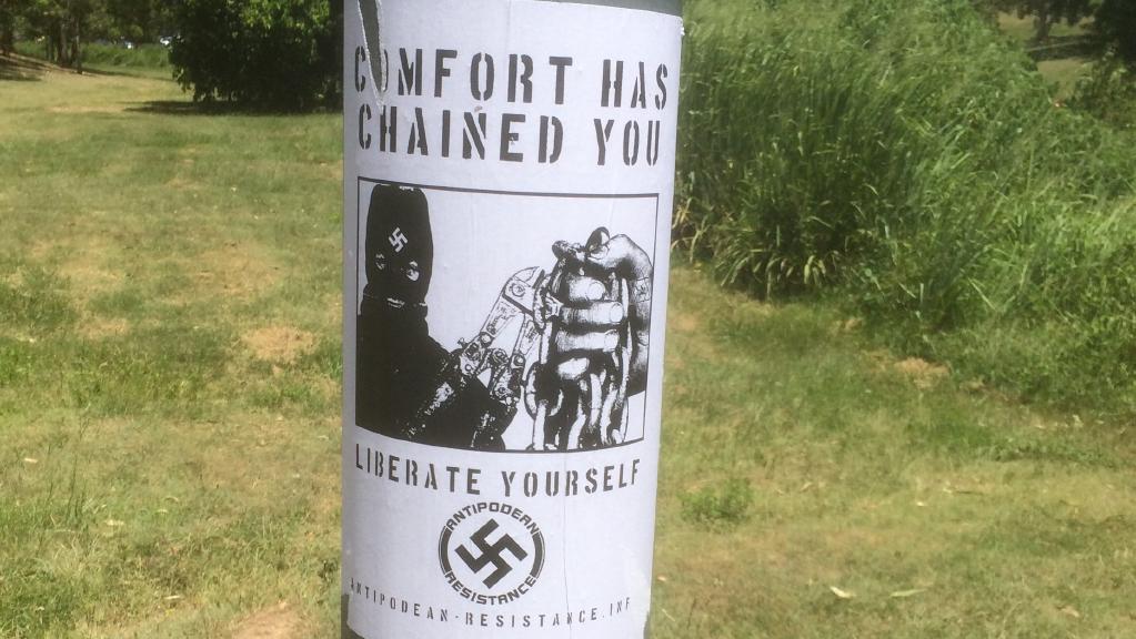 the poster wrapped around a pole