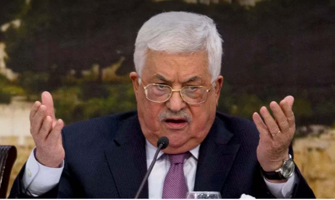 Abbas at the microphone, gesticulating