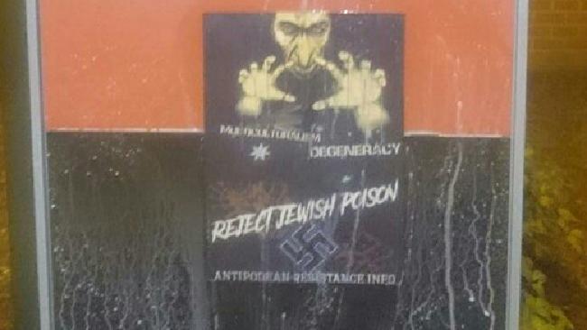poster with swastika and caricature of evil jewish person