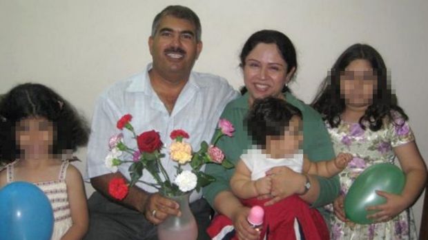 Hamed with his wife and children