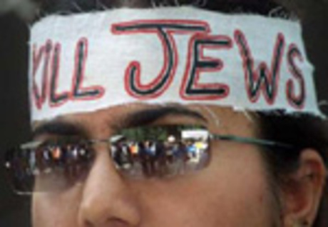 someone wearing a homemade headband that reads "kill jews"