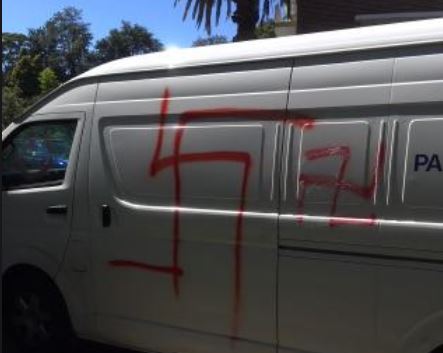 swastika spray painted on van