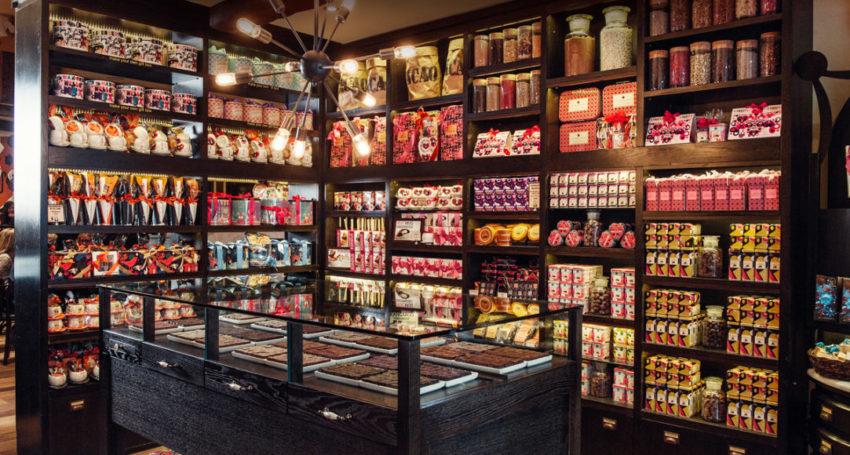interior of a Max Brenner stop with highly stocked shelves