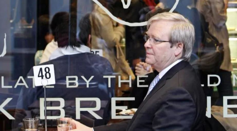 Kevin Rudd sitting at an outdoor table at Max brenner chocolate shop