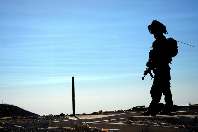 silhouette of Israeli soldier standing guard